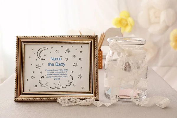 Game for suggestion of baby name on table at shower party — Stockfoto