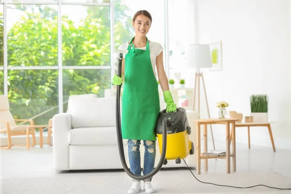 Woman with steam vapor cleaner