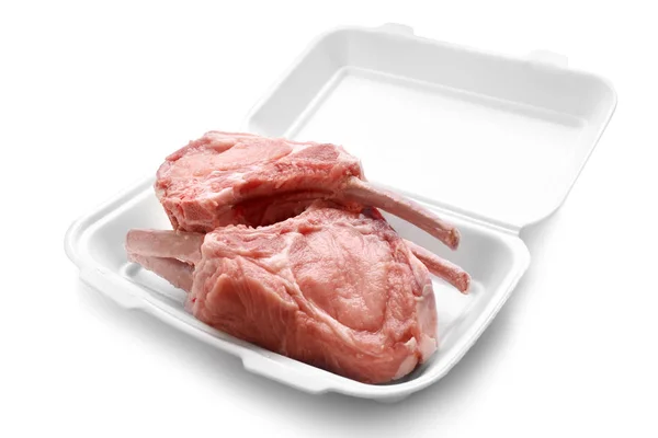 Raw ribs in container on white background — Stock Photo, Image