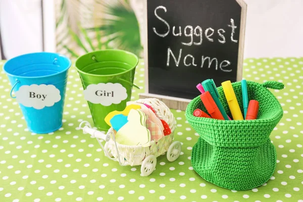 Game for suggestion of baby name on table at shower party — Stock Photo, Image