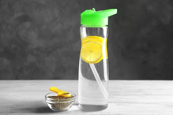 Bottle of water and bowl — Stock Photo, Image