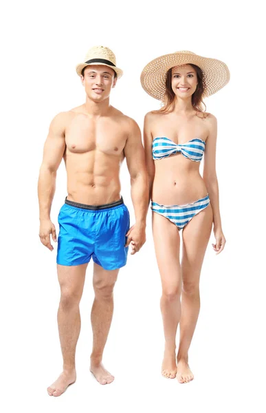 白い背景の上の水着で若いカップル — ストック写真