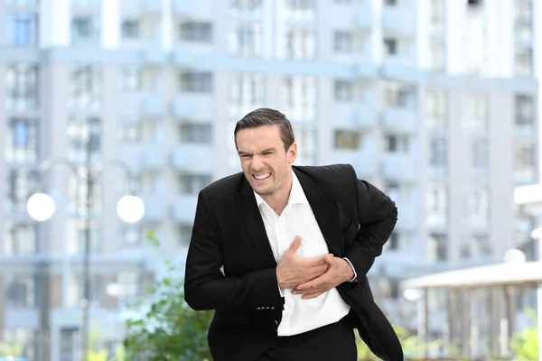 Mature Man Suffering Heart Attack Outdoors — Stock Photo, Image