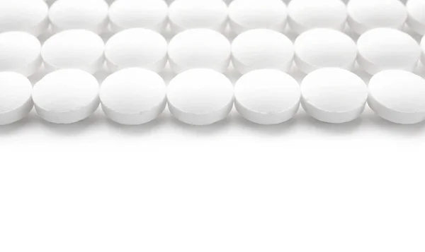 Round pills on white — Stock Photo, Image