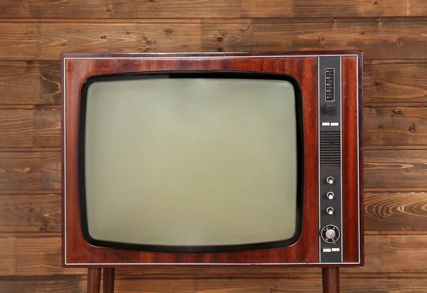 Retro-Fernseher auf Holz — Stockfoto
