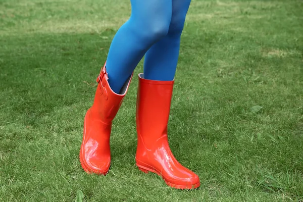 Young woman in red rubber boots — Stock Photo, Image