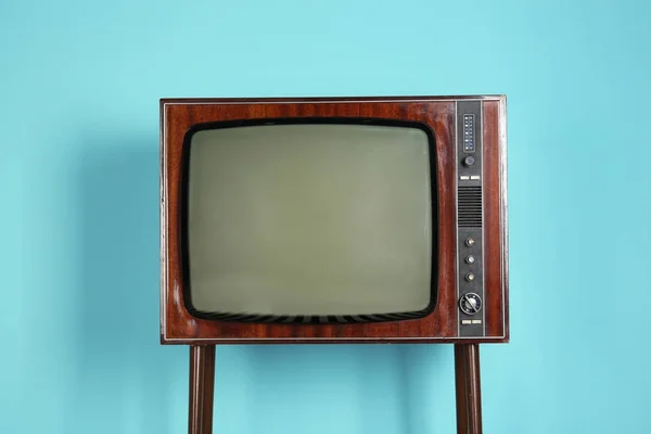 Vintage television on color background — Stock Photo, Image