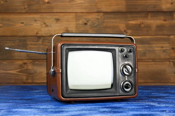 Retro Tv op houten — Stockfoto