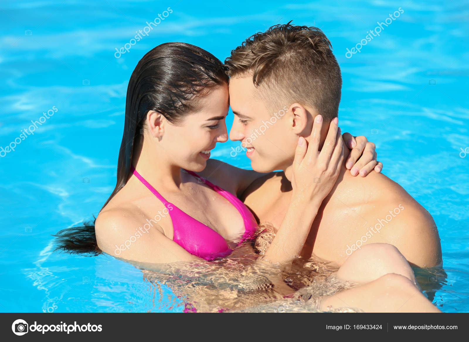Happy Young Couple In Swimming Pool At Resort Stock Photo Image By C Belchonock Happy Young Couple In Swimming Pool At Resort Stock Photo Image By C Belchonock