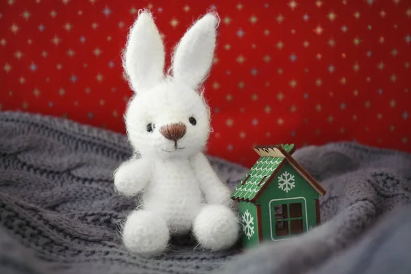 Small bunny toy and decorative house — Stock Photo, Image