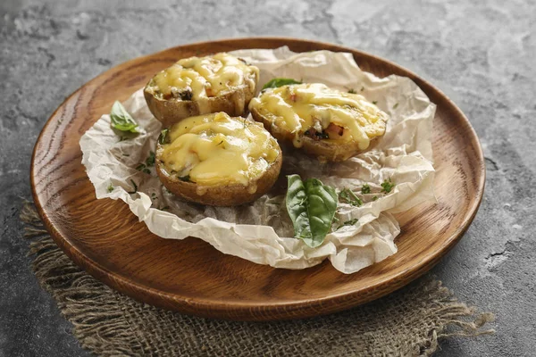 Stuffed potatoes on wooden tray — Stock Photo, Image