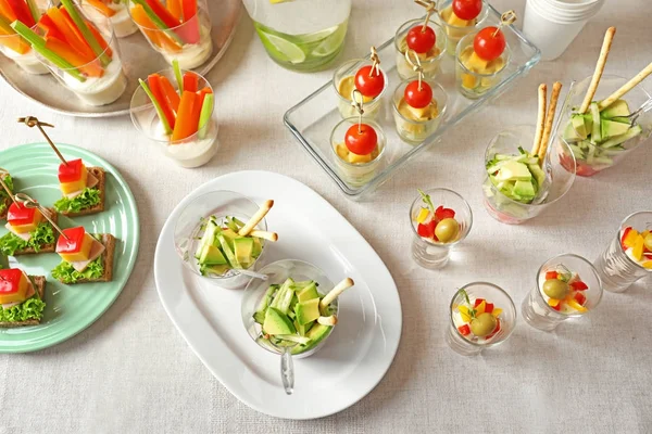 Table with different snacks — Stock Photo, Image