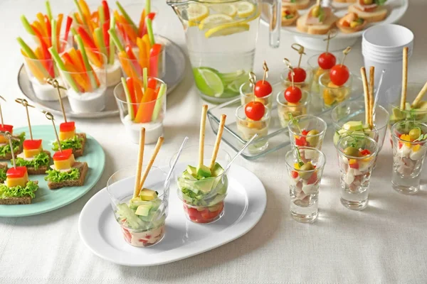 Table with different snacks — Stock Photo, Image