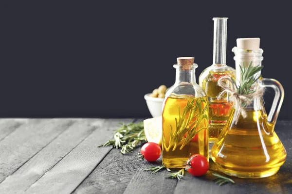 Composition with rosemary oil and tomatoes — Stock Photo, Image