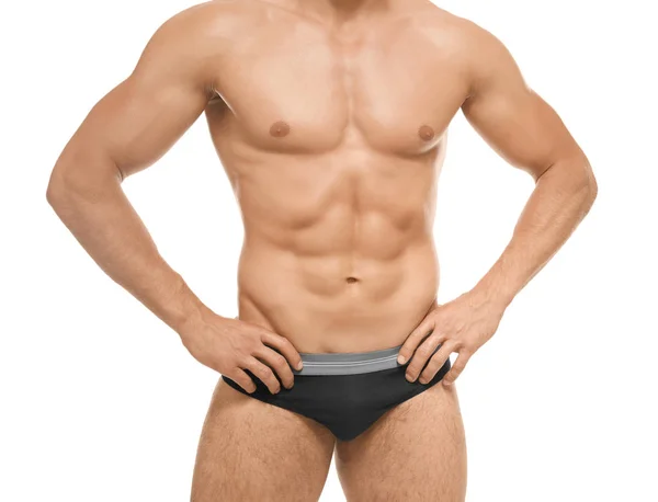 Muskulöser Mann in Unterwäsche auf weißem Hintergrund — Stockfoto