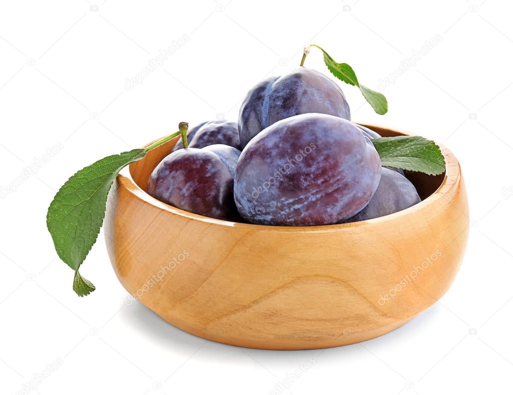 Bowl with ripe plums