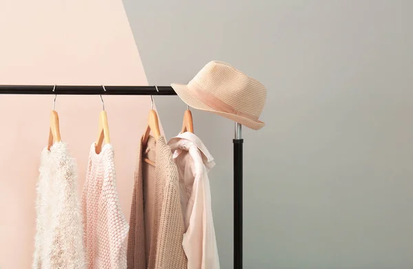 Apricot and beige clothes on hangers