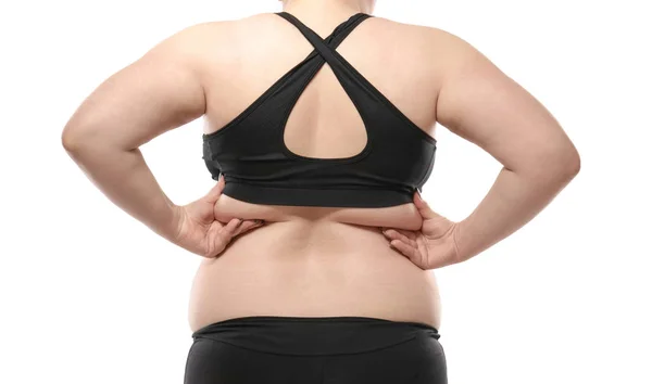 Femme touchant la graisse sur le dos sur fond blanc. Concept de perte de poids — Photo