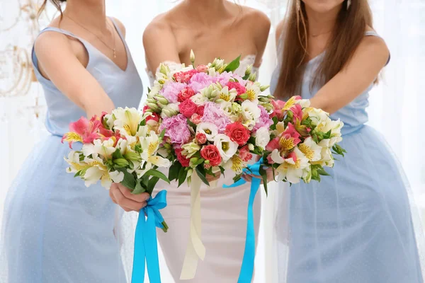 Happy beautiful bride with bridesmaids on wedding day — Stock Photo, Image