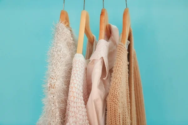 Apricot and beige clothes on hangers