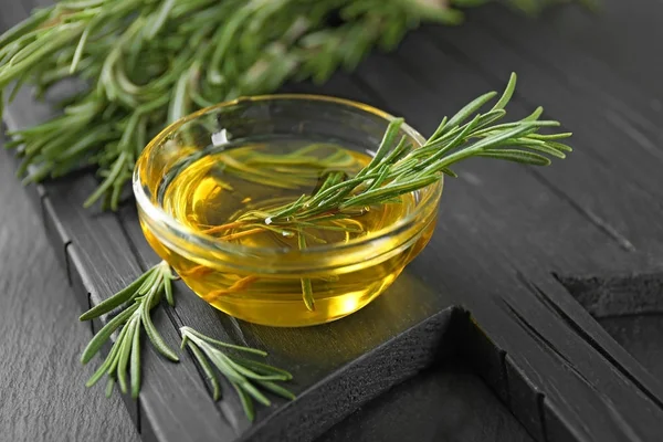 Bowl with rosemary oil — Stock Photo, Image