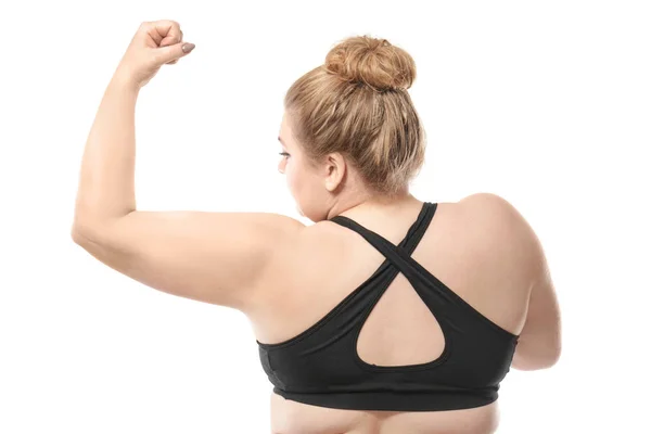 Mujer tocando grasa en su brazo contra fondo blanco. Concepto de pérdida de peso —  Fotos de Stock