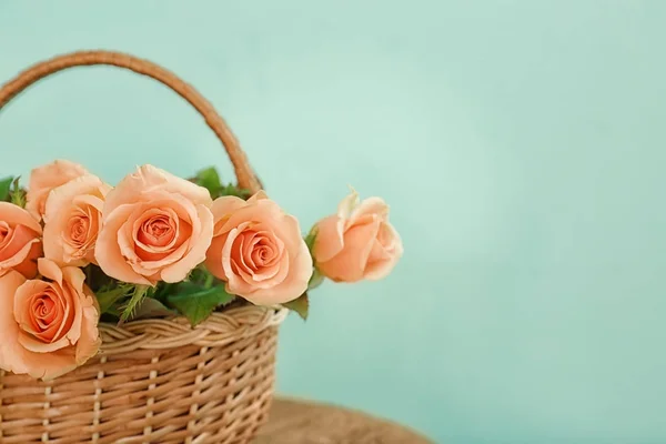 Apricot roses in wicker basket