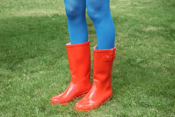 woman in red rubber boots