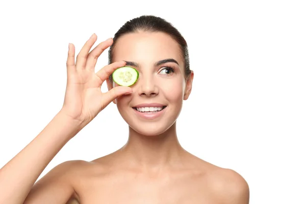 Young woman with cucumber slice — Stock Photo, Image