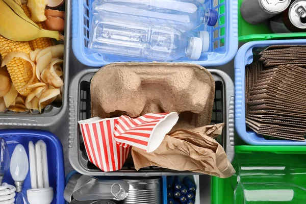 set of plastic containers with garbage
