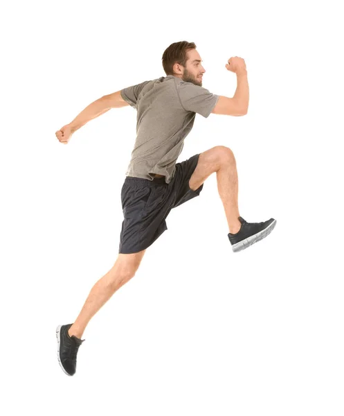 Jovem de sportswear correndo em fundo branco — Fotografia de Stock