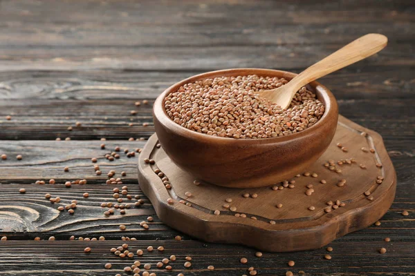 Bowl with brown lentils — Stock Photo, Image