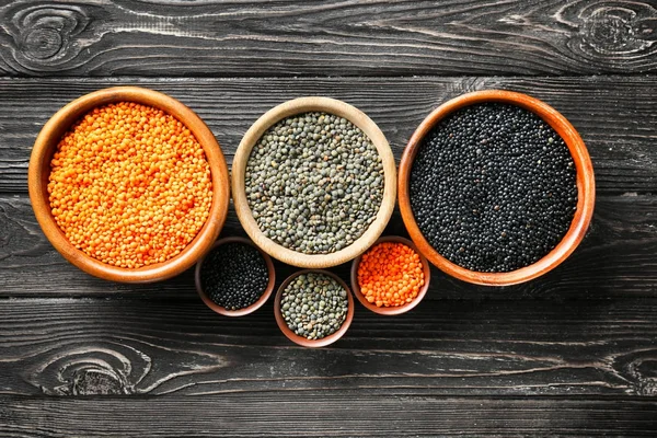 Bowls with different lentils — Stock Photo, Image