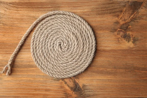 Hemp rope on wooden background — Stock Photo, Image