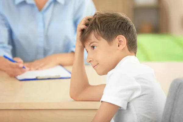 Cute boy at table in psychologists office — Stock Photo, Image