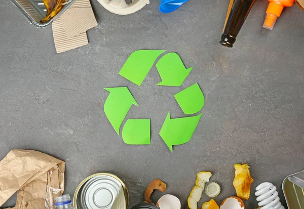 Recycling sign and garbage