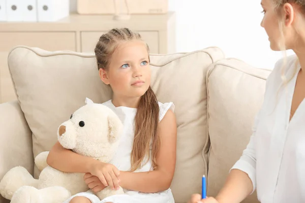 Young psychologist working with little girl in office — Stock Photo, Image