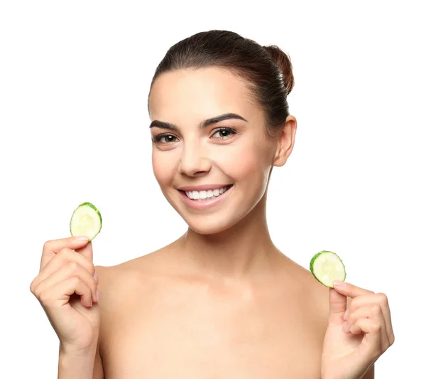 Young woman with cucumber slices — Stock Photo, Image