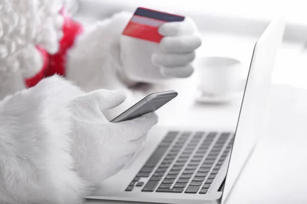 Santa Claus with phone, laptop and credit card, closeup — Stock Photo, Image