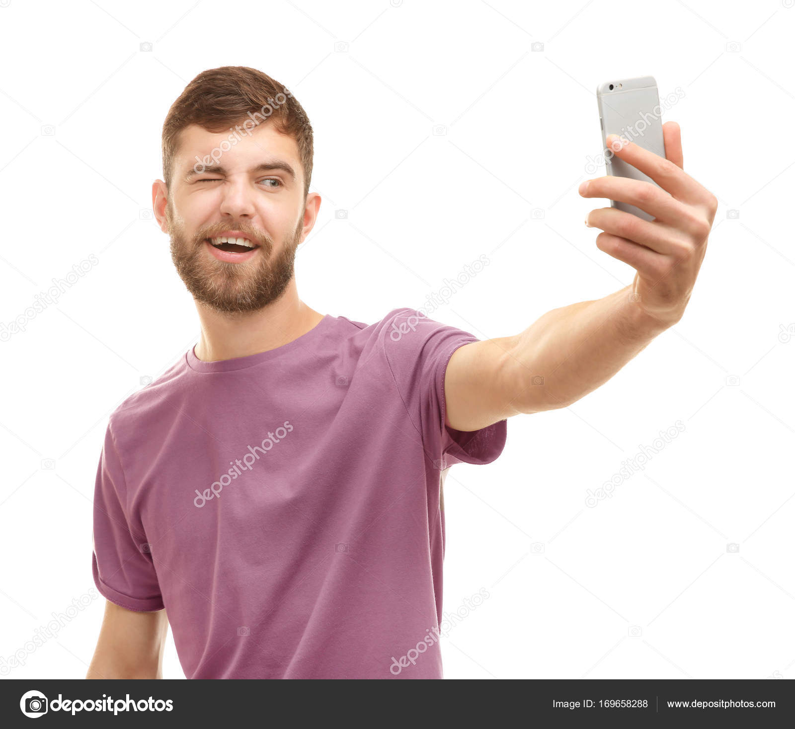 Young man taking selfie against white background Stock Photo by ©belchonock  169658288