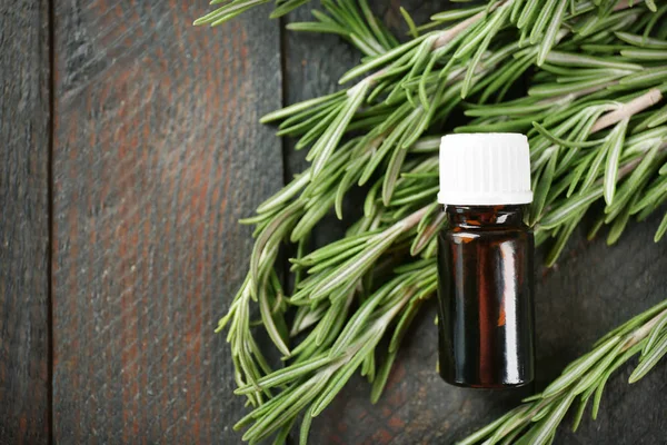 Bottle with rosemary oil — Stock Photo, Image