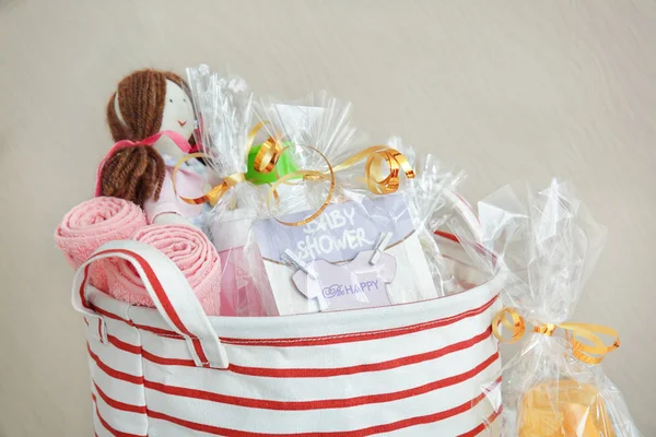 Baby shower gifts against color background — Stock Photo, Image