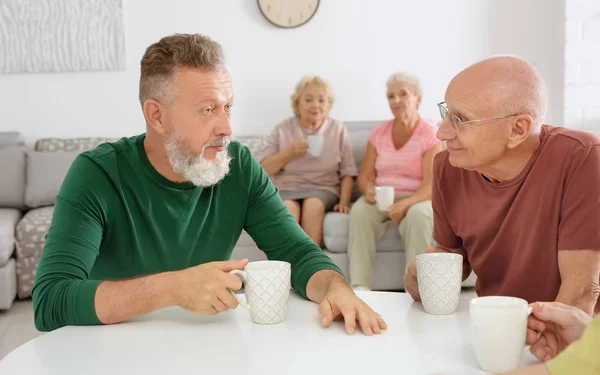 Group of elderly people resting at home