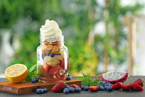 Mason jar with fruits and berries — Stock Photo, Image