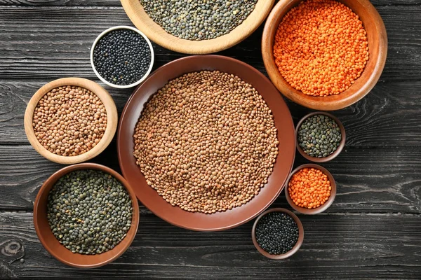 Bowls with different lentils — Stock Photo, Image