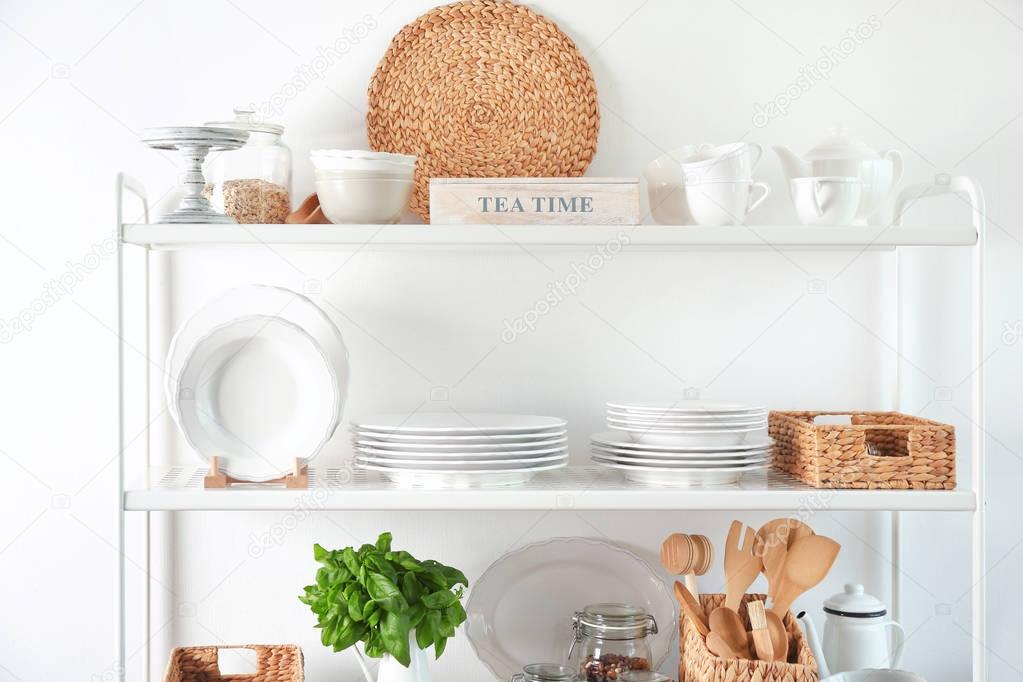 Storage stand with kitchenware, indoors