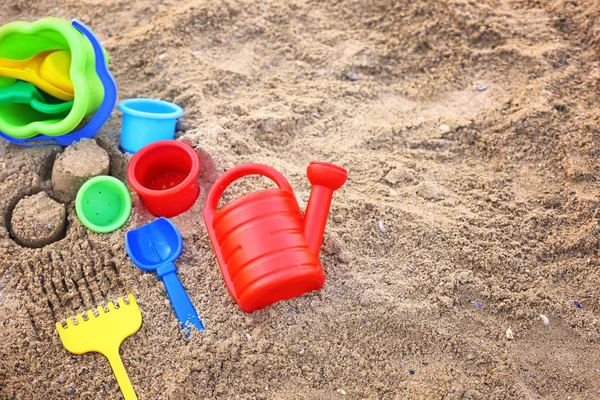 Children's beach toys on sand — Stock Photo, Image