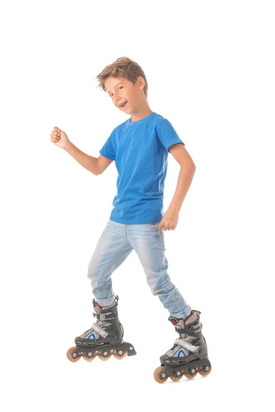 Menino bonito em patins contra fundo branco — Fotografia de Stock