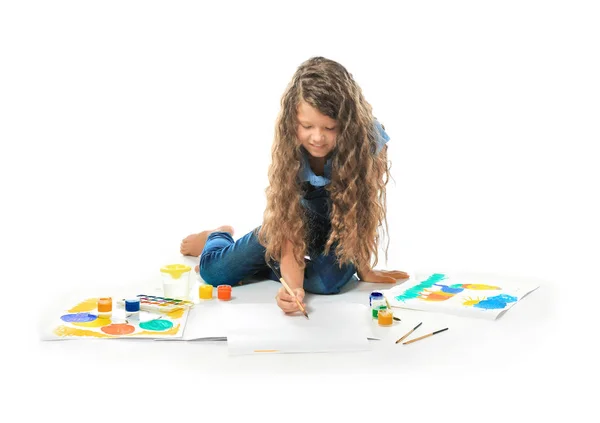 Little cute girl painting picture against white background — Stock Photo, Image