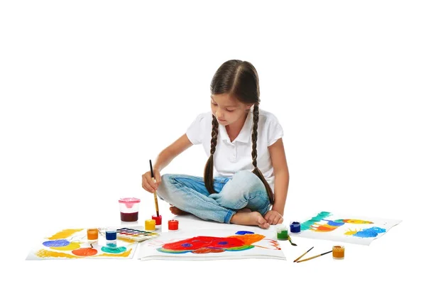Little cute girl painting picture against white background — Stock Photo, Image